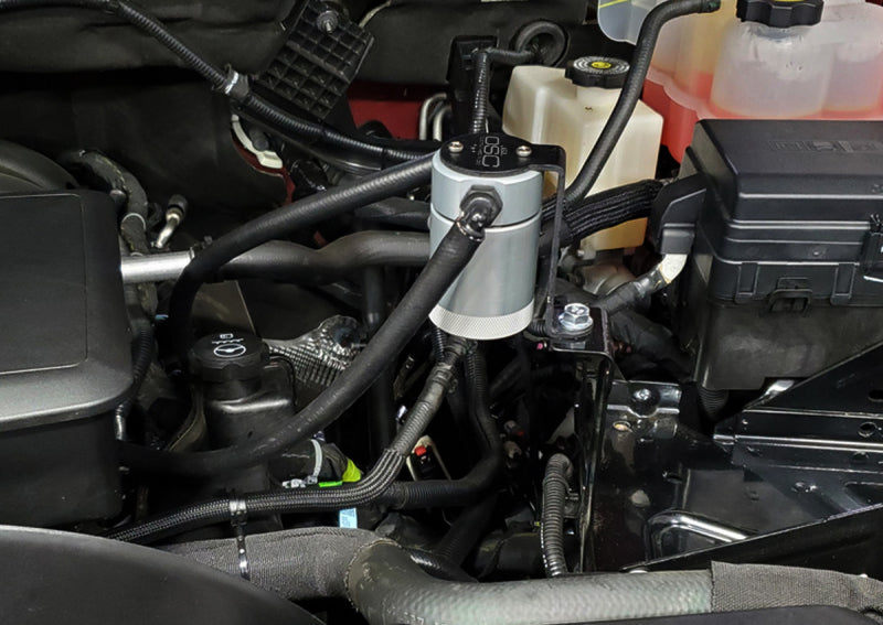 Load image into Gallery viewer, J&L 20-26 Chevy Silverado/GMC Sierra 2500/3500 6.6L Drivers Side Oil Separator 3.0 - Clear Anodi