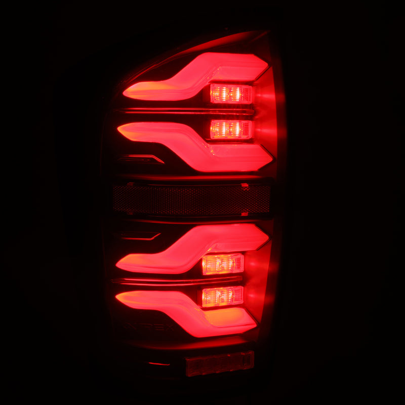 Load image into Gallery viewer, AlphaRex 16-21 Toyota TacomaLUXX LED Taillights Blk w/Activ Light/Seq Signal