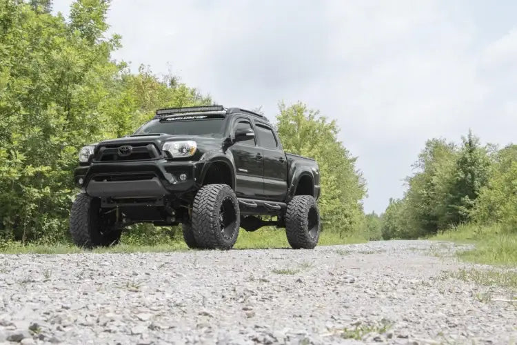 Load image into Gallery viewer, Rough Country | 2005-2023 Toyota Tacoma Double Cab 5' Bed Nerf Steps | RCT0580CC