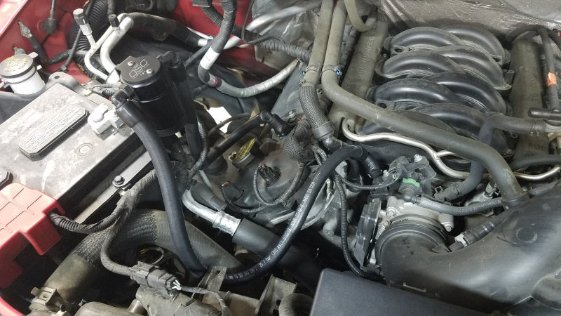 Load image into Gallery viewer, J&amp;L 2011-2025 Ford F-150 2.7L/3.5L/5.0L Passenger Side Oil Separator 3.0 - Black Anodized
