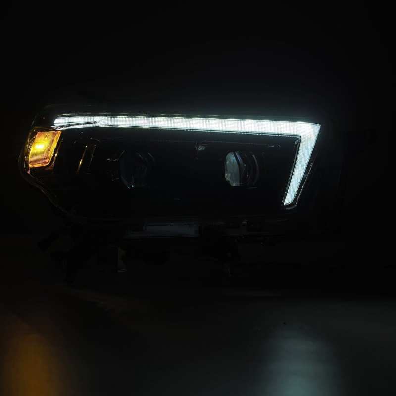 Load image into Gallery viewer, AlphaRex 10-13 Toyota 4Runner LUXX LED Proj Headlights Plank Style Alpha Black w/Seq Signal/DRL
