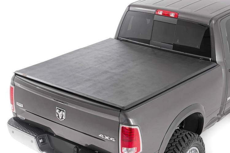 Load image into Gallery viewer, Rough Country | 2019-2024 Dodge Ram 1500 / 2021-2024 TRX Soft Tri-Fold Bed Cover - 5&#39; 7 Inch Bed
