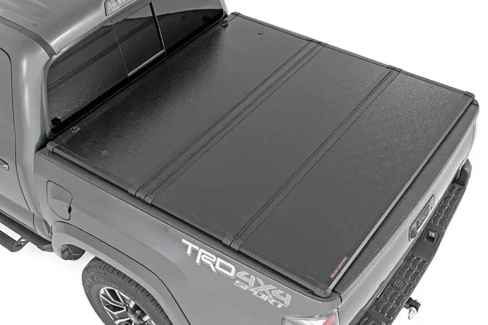 Rough Country | 2016-2023 Toyota Tacoma 5' Hard Folding Bed Cover | 45716501A