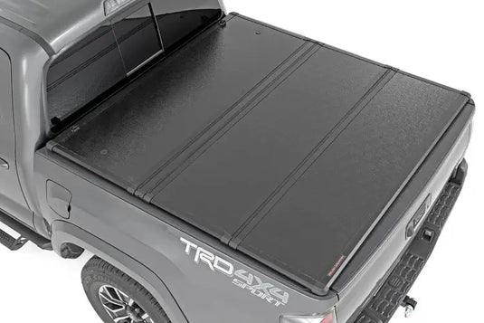 Rough Country | 2016-2023 Toyota Tacoma 5' Hard Folding Bed Cover | 45716501A