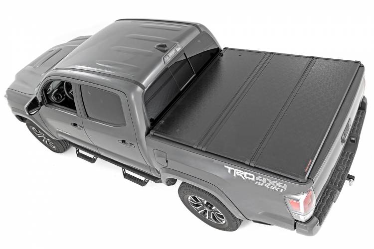 Load image into Gallery viewer, Rough Country | 2016-2023 Toyota Tacoma 5&#39; Hard Folding Bed Cover | 45716501A
